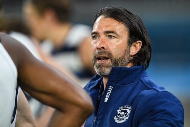 Chris Scott, Senior Coach of the Cats addresses his players at three quarter time during the 2021 AFL First Preliminary Final match between the...