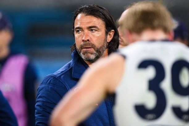 Chris Scott, Senior Coach of the Cats addresses his players at three quarter time during the 2021 AFL First Preliminary Final match between the...