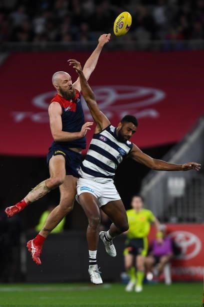 Max Gawn of the Demons competes in a ruck contest with Esava Ratugolea of the Cats during the 2021 AFL First Preliminary Final match between the...