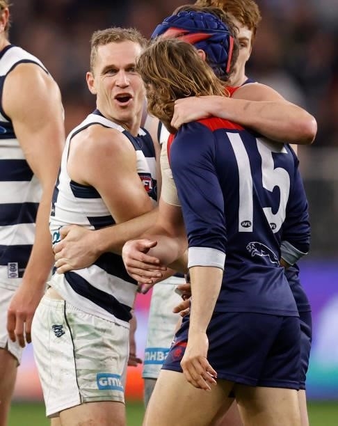 Joel Selwood of the Cats and Ed Langdon of the Demons exchange words during the 2021 AFL First Preliminary Final match between the Melbourne Demons...