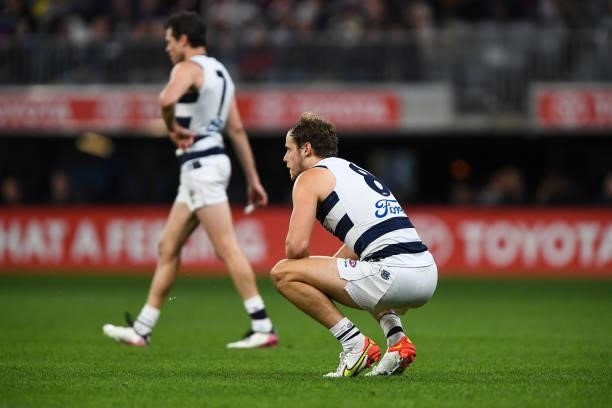 Jake Kolodjashnij of the Cats is exhausted during the 2021 AFL First Preliminary Final match between the Melbourne Demons and the Geelong Cats at...