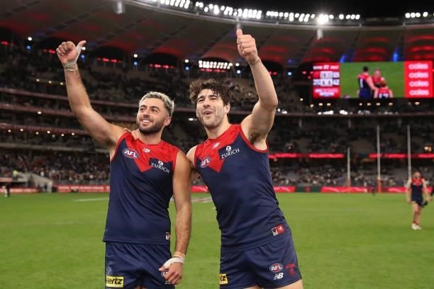 Christian Salem and Christian Petracca of the Demons acknowledge the crowd after the win during the 2021 AFL First Preliminary Final match between...