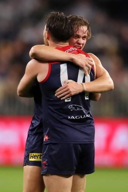 Trent Rivers and Michael Hibberd of the Demons celebrate after the teams win during the 2021 AFL First Preliminary Final match between the Melbourne...