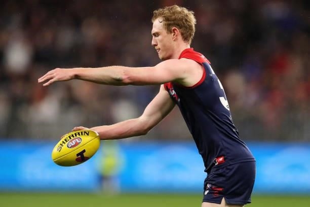 Harrison Petty of the Demons looks to pass the ball during the 2021 AFL First Preliminary Final match between the Melbourne Demons and the Geelong...