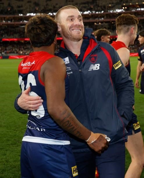 Kysaiah Pickett and Simon Goodwin, Senior Coach of the Demons celebrate during the 2021 AFL First Preliminary Final match between the Melbourne...