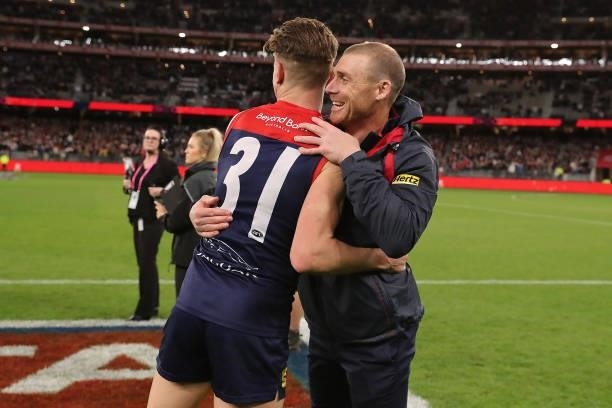 Bayley Fritsch of the Demons celebrates with Simon Goodwin after the win during the 2021 AFL First Preliminary Final match between the Melbourne...
