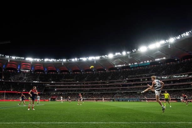 Zach Guthrie of the Cats kicks the ball during the 2021 AFL First Preliminary Final match between the Melbourne Demons and the Geelong Cats at Optus...