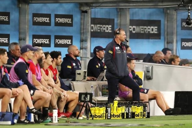 Simon Goodwin, Senior Coach of the Demons works from the sidelines during the 2021 AFL First Preliminary Final match between the Melbourne Demons and...