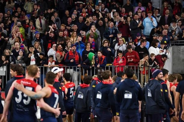 Demons fans cheer their team off after the win during the 2021 AFL First Preliminary Final match between the Melbourne Demons and the Geelong Cats at...