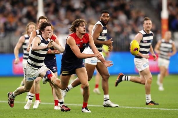 Trent Rivers of the Demons handpasses the ball during the 2021 AFL First Preliminary Final match between the Melbourne Demons and the Geelong Cats at...