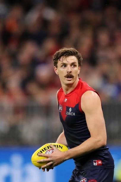 Jake Lever of the Demons looks to pass the ball during the 2021 AFL First Preliminary Final match between the Melbourne Demons and the Geelong Cats...