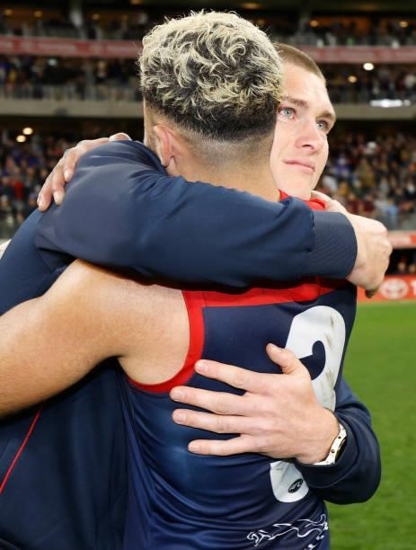 Adam Tomlinson of the Demons sheds a tear as Christian Salem of the Demons embraces him during the 2021 AFL First Preliminary Final match between the...