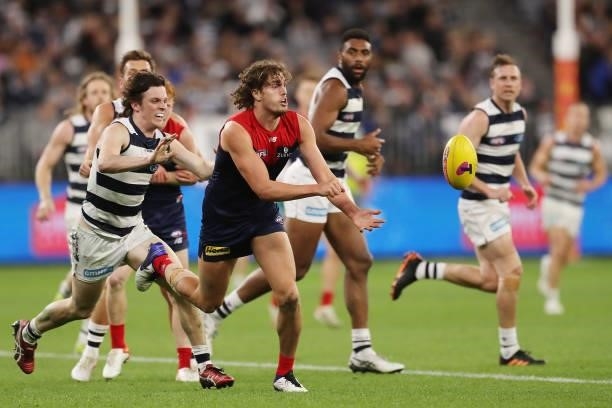 Luke Jackson of the Demons handpasses the ball during the 2021 AFL First Preliminary Final match between the Melbourne Demons and the Geelong Cats at...