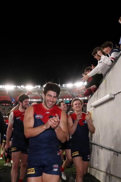Christian Petracca of the Demons celebrates after the teams win during the 2021 AFL First Preliminary Final match between the Melbourne Demons and...
