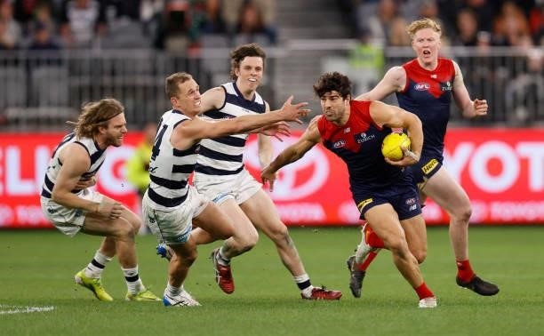 Christian Petracca of the Demons and Joel Selwood of the Cats in action during the 2021 AFL First Preliminary Final match between the Melbourne...