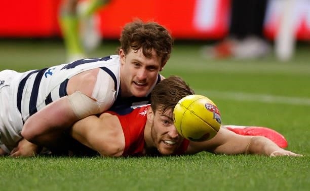 Jed Bews of the Cats and Jack Viney of the Demons compete for the ball during the 2021 AFL First Preliminary Final match between the Melbourne Demons...