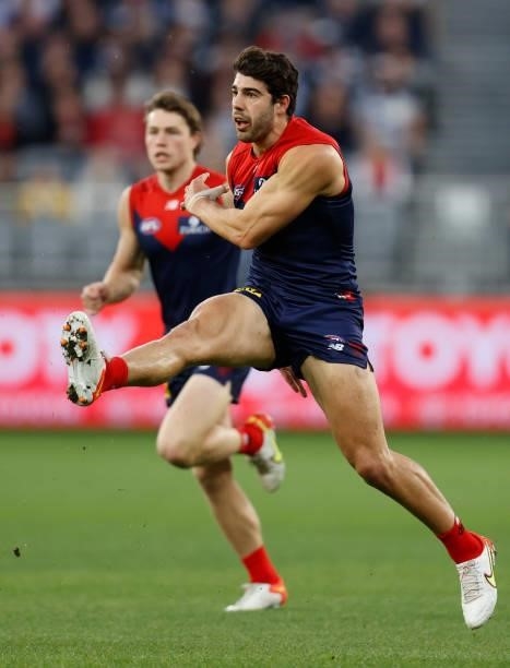 Christian Petracca of the Demons kicks the ball during the 2021 AFL First Preliminary Final match between the Melbourne Demons and the Geelong Cats...