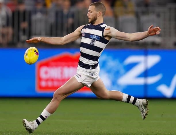 Sam Menegola of the Cats kicks the ball during the 2021 AFL First Preliminary Final match between the Melbourne Demons and the Geelong Cats at Optus...