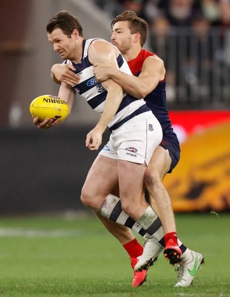 Patrick Dangerfield of the Cats is tackled by Jack Viney of the Demons during the 2021 AFL First Preliminary Final match between the Melbourne Demons...