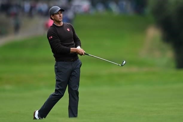 Australia's Adam Scott watches the ball after playing a shot on the 17th on Day 2 of the PGA Championship at Wentworth Golf Club in Surrey, south...