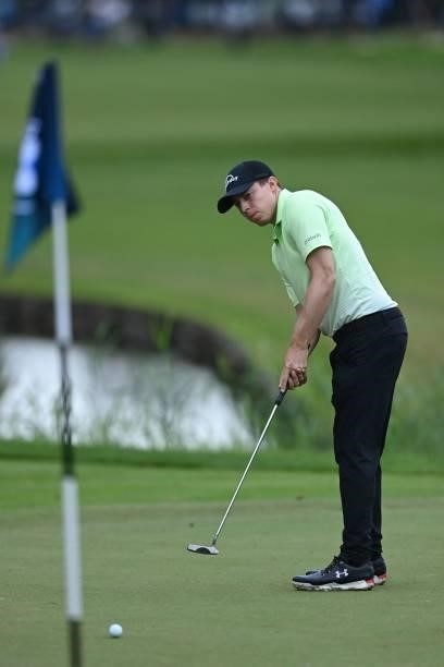 England's Matthew Fitzpatrick putts on the 18th on Day 2 of the PGA Championship at Wentworth Golf Club in Surrey, south west of London on September...