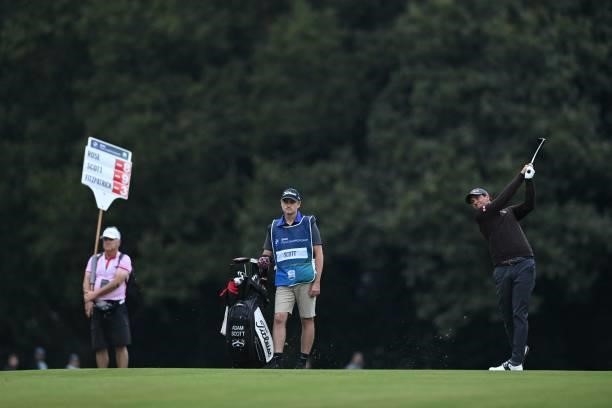 Australia's Adam Scott watches the ball after playing a shot on the 18th on Day 2 of the PGA Championship at Wentworth Golf Club in Surrey, south...