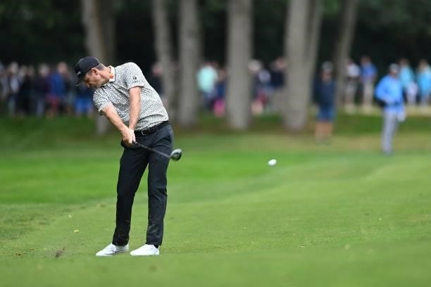 England's Justin Rose plays a shot on the 17th on Day 2 of the PGA Championship at Wentworth Golf Club in Surrey, south west of London on September...
