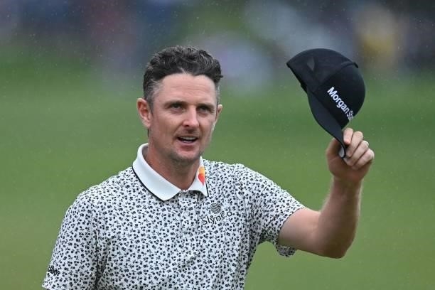 England's Justin Rose acknowledges the crowd on the 18th on Day 2 of the PGA Championship at Wentworth Golf Club in Surrey, south west of London on...