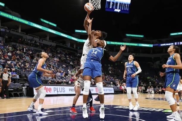 Teaira McCowan of the Indiana Fever drives to the basket as Sylvia Fowles of the Minnesota Lynx plays defense during the game on September 10, 2021...