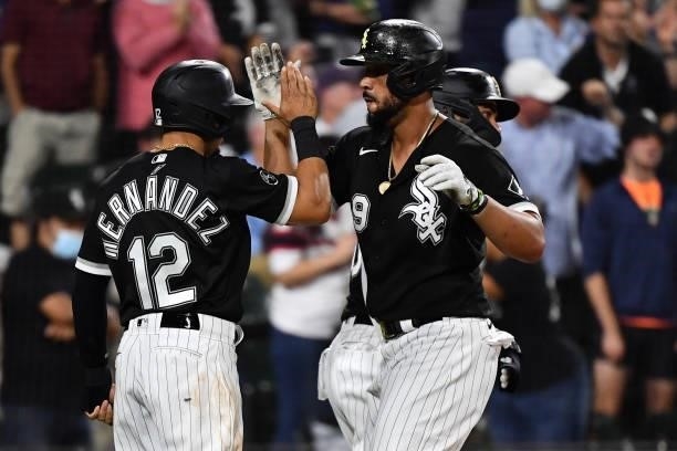 César Hernández and José Abreu of the Chicago White Sox celebrate at home plate after Abreu hit a three-run home run in the third inning against the...