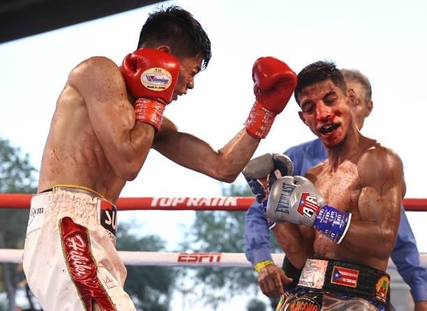 Junto Nakatani and Angel Acosta exchange punches during their fight for the WBO flyweight championship at Casino del Sol on September 10, 2021 in...