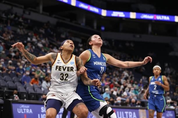 Emma Cannon of the Indiana Fever and Natalie Achonwa of the Minnesota Lynx fight for position during the game on September 10, 2021 at Target Center...