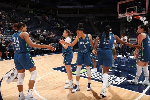 Aerial Powers of the Minnesota Lynx celebrates a win with Napheesa Collier after the game against the Indiana Fever on September 10, 2021 at Target...