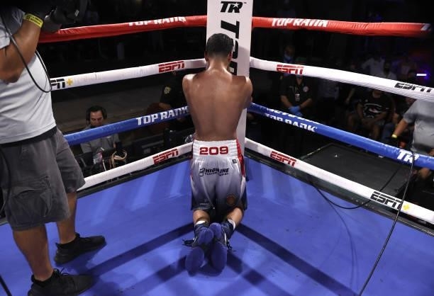 Gabriel Flores Jr praying after his loss to Luis Alberto Lopez at Casino del Sol on September 10, 2021 in Tucson, Arizona.