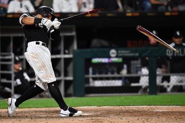 César Hernández of the Chicago White Sox breaks his bat on a single in the eighth inning against the Boston Red Sox at Guaranteed Rate Field on...
