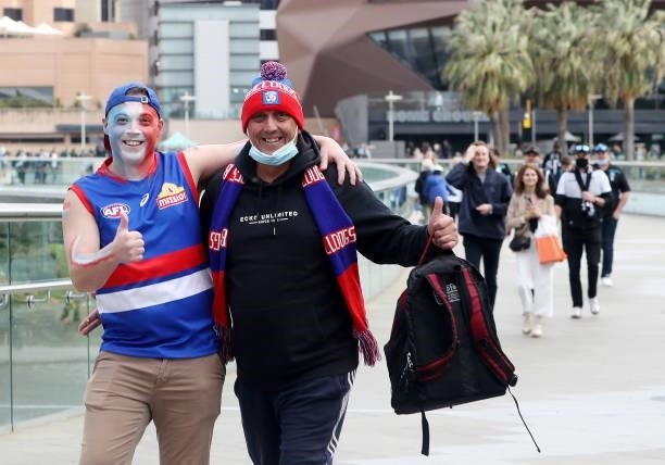 Bulldogs fans walk across the bridge before the 2021 AFL Second Preliminary Final match between the Port Adelaide Power and the Western Bulldogs at...