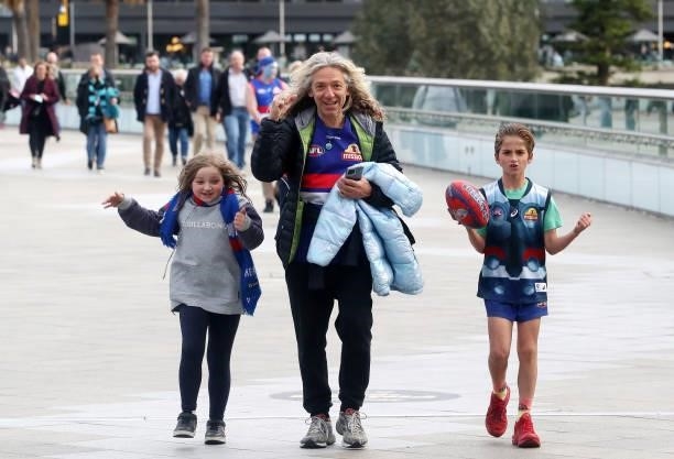 Bulldogs fans walk across the bridge before the 2021 AFL Second Preliminary Final match between the Port Adelaide Power and the Western Bulldogs at...