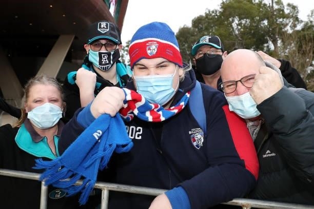 Bulldogs fan surround by Power supporters during the 2021 AFL Second Preliminary Final match between the Port Adelaide Power and the Western Bulldogs...
