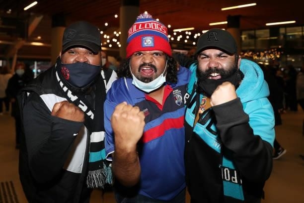Fans pose for photos before the 2021 AFL Second Preliminary Final match between the Port Adelaide Power and the Western Bulldogs at Adelaide Oval on...