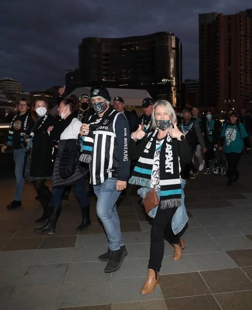 Fans arrive for the 2021 AFL Second Preliminary Final match between the Port Adelaide Power and the Western Bulldogs at Adelaide Oval on September...