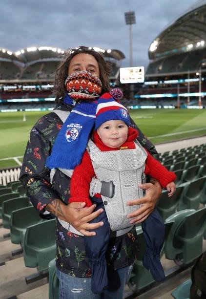 Bulldog fans pose for a photo ahead of the 2021 AFL Second Preliminary Final match between the Port Adelaide Power and the Western Bulldogs at...