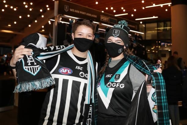 Port fans pose for photos before the 2021 AFL Second Preliminary Final match between the Port Adelaide Power and the Western Bulldogs at Adelaide...