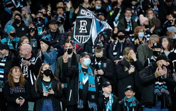Power fans cheer from the stands during the 2021 AFL Second Preliminary Final match between the Port Adelaide Power and the Western Bulldogs at...