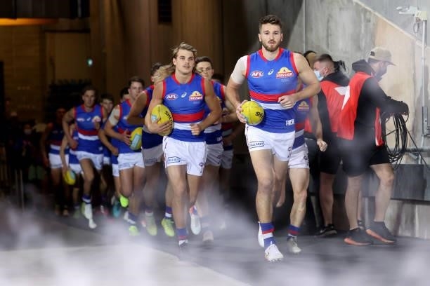 Marcus Bontempelli of the Bulldogs leads his team out during the 2021 AFL Second Preliminary Final match between the Port Adelaide Power and the...