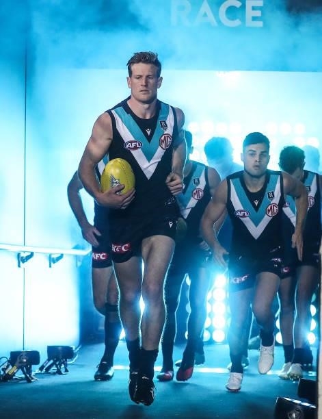 Tom Jonas leads his team out onto the oval during the 2021 AFL Second Preliminary Final match between the Port Adelaide Power and the Western...