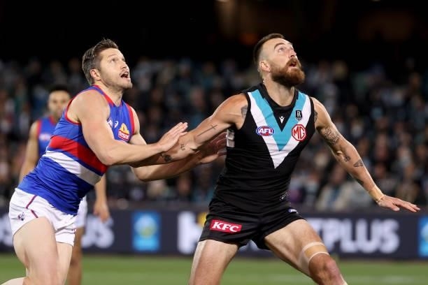 Stefan Martin of the Bulldogs competes with Charlie Dixon of the Power during the 2021 AFL Second Preliminary Final match between the Port Adelaide...
