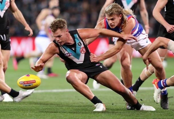 Dan Houston of the Power and Bailey Smith of the Bulldogs during the 2021 AFL Second Preliminary Final match between the Port Adelaide Power and the...