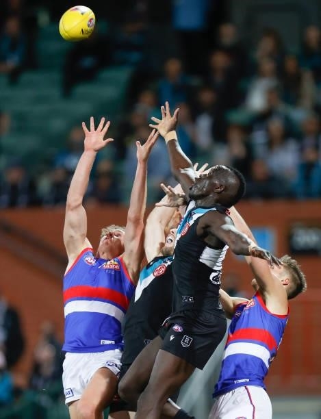 Aaron Naughton of the Bulldogs and Aliir Aliir of the Power compete for the ball during the 2021 AFL Second Preliminary Final match between the Port...
