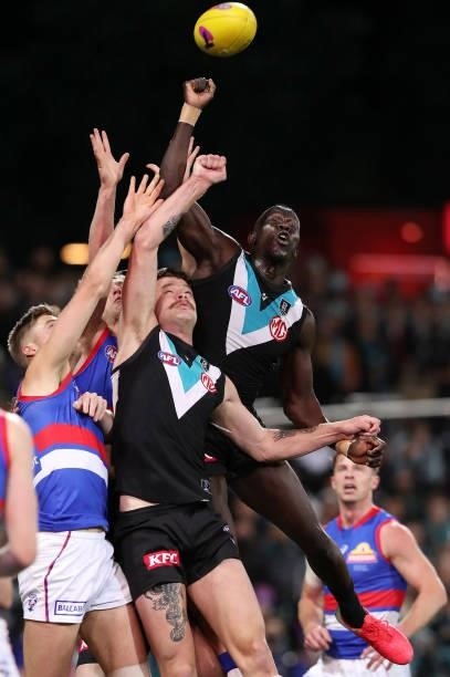 Aliir Aliir of the Power Punches the ball away during the 2021 AFL Second Preliminary Final match between the Port Adelaide Power and the Western...