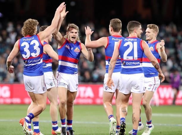 Bailey Smith of the Bulldogs celebrates a goal with team mates during the 2021 AFL Second Preliminary Final match between the Port Adelaide Power and...